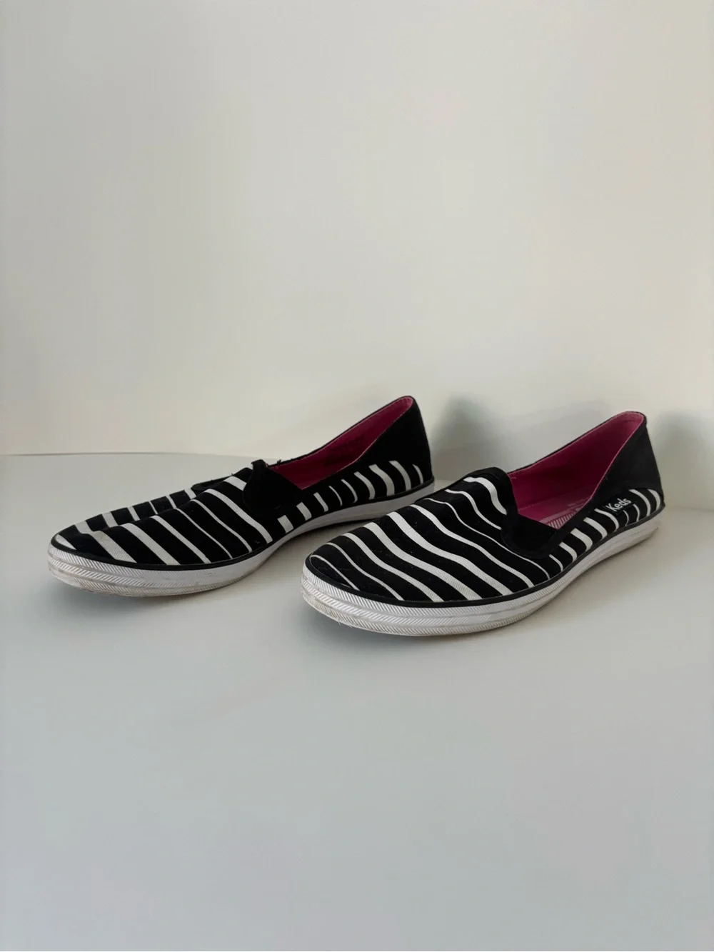 Keds Women’s Black & White Striped Slip-On Sneakers with Pink Insole